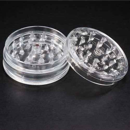 Lightweight, transparent plastic herb grinder with sharp teeth for tobacco, herbs, and spices