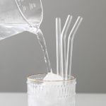 4-pack of high borosilicate transparent glass straws, heat-resistant and durable, with a free brush
