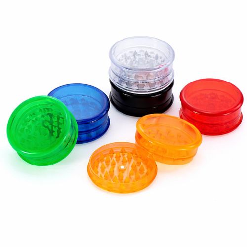 Lightweight, transparent plastic herb grinder with sharp teeth for tobacco, herbs, and spices