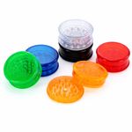 Lightweight, transparent plastic herb grinder with sharp teeth for tobacco, herbs, and spices