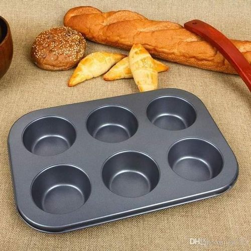 A Set Of 4 Different Shapes Of Baking Tin