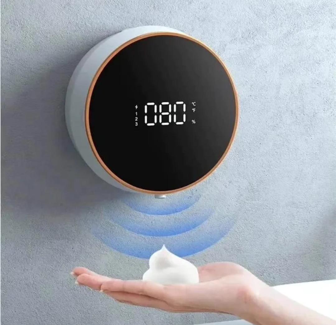Automatic soap dispenser with temperature display.